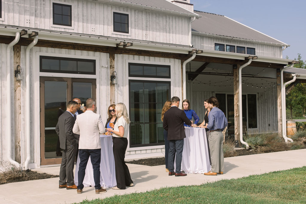Professional gathering outside of the Farmstead at Kent Island Resort